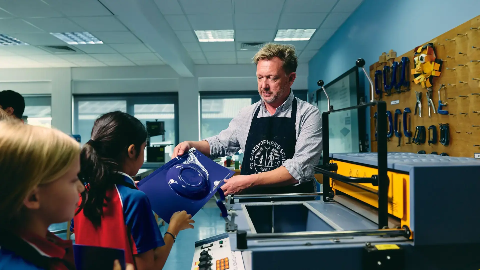 Teacher assisting students in class